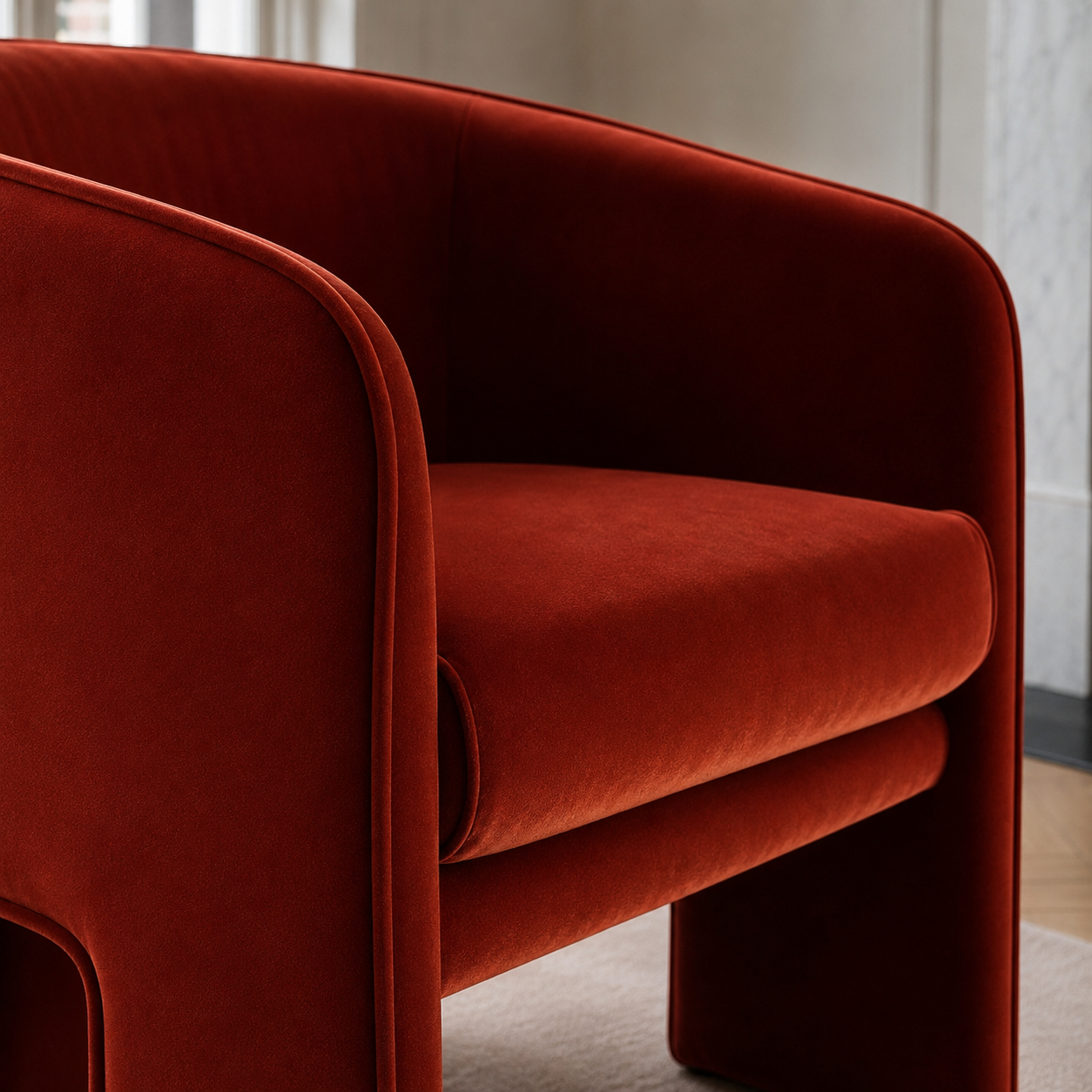 Contemporary sculptural accent armchair with a wraparound design, available in ivory bouclé, red velvet and green velvet upholstery.