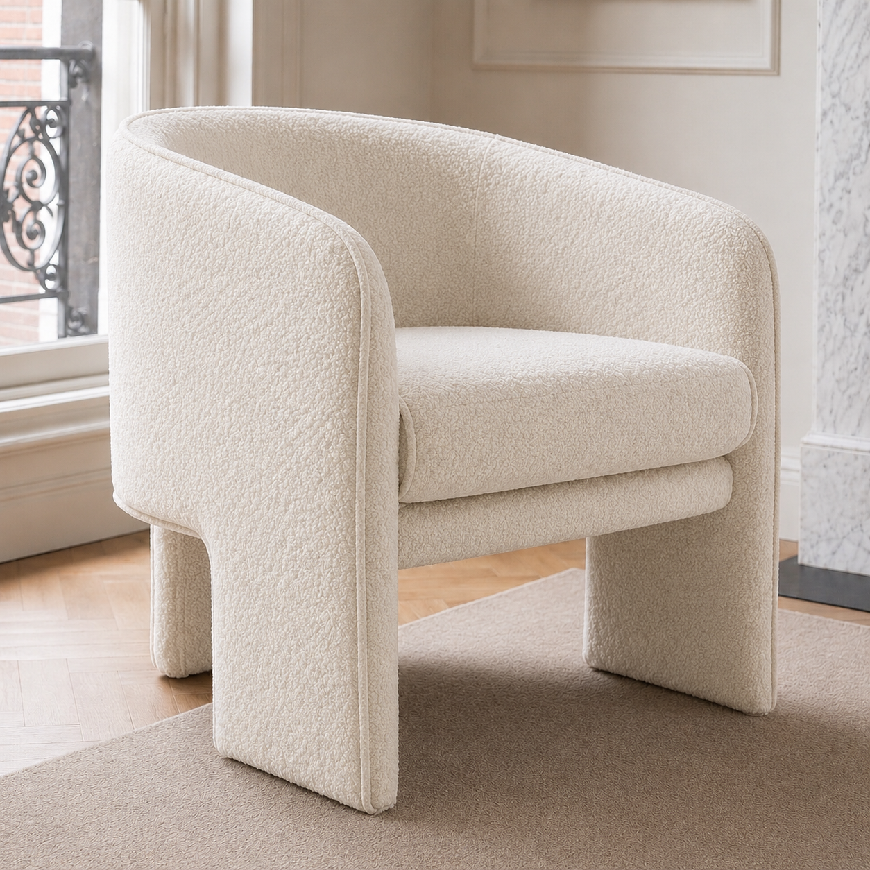 Contemporary sculptural accent armchair with a wraparound design, available in ivory bouclé, red velvet and green velvet upholstery.