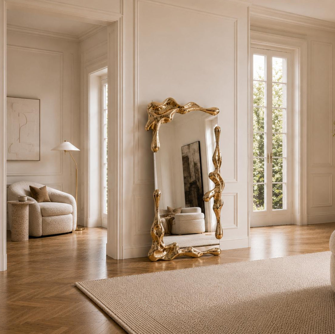 Sculptural full length liquid mirror with an organically shaped polished gold frame in a luxury contemporary interior.