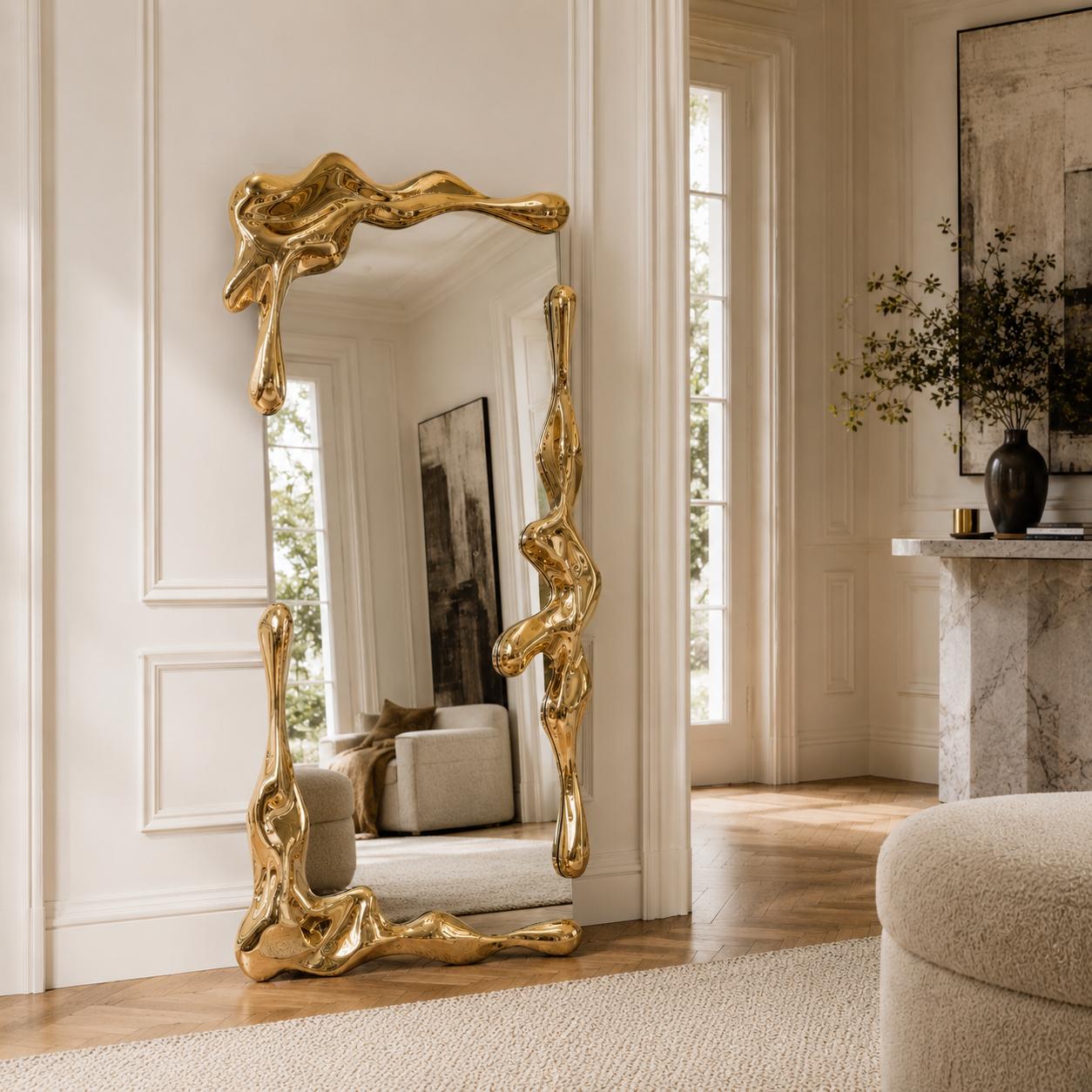 Sculptural full length liquid mirror with an organically shaped polished gold frame in a luxury contemporary interior.