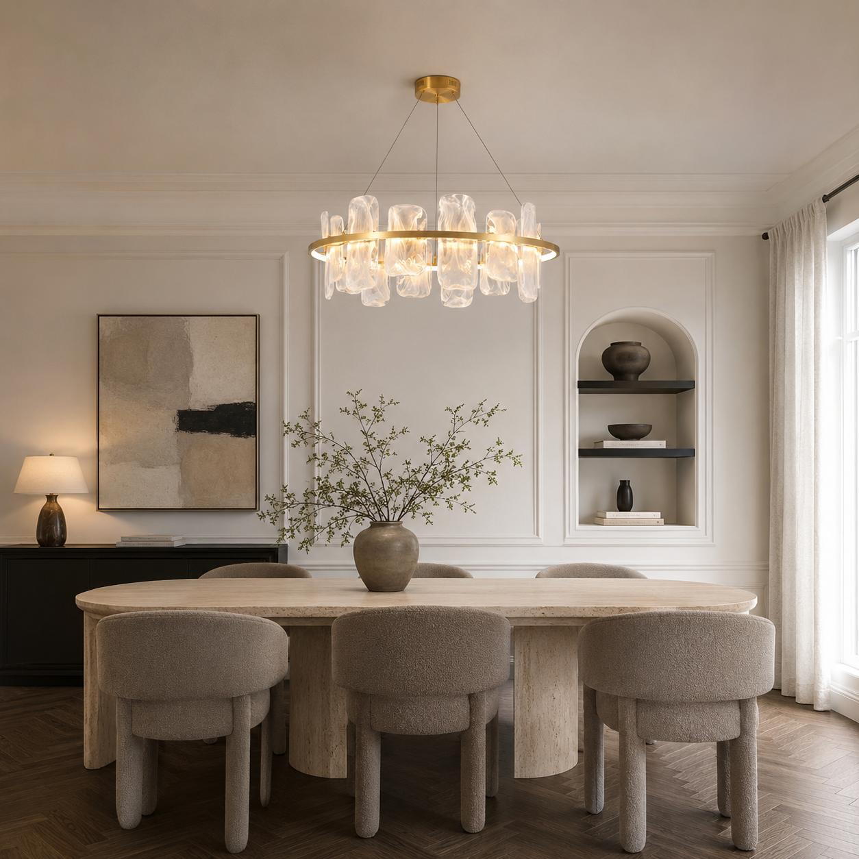 Contemporary brushed gold circular chandelier with smoked pattern glass shades suspended above a luxury dining space.