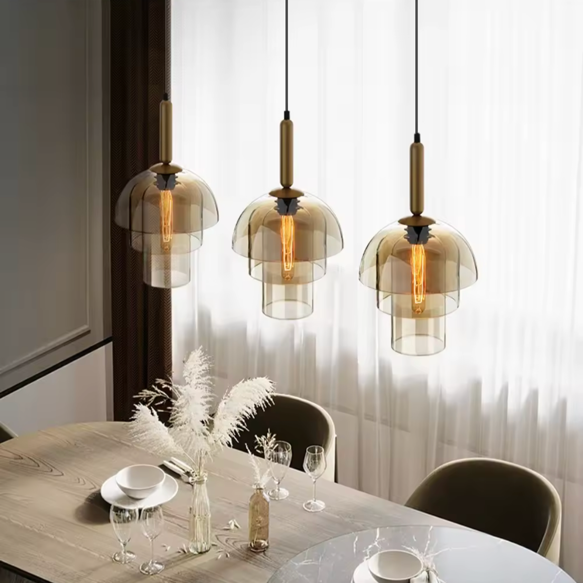 Dining room with modern pendant lights and a neutral color scheme.