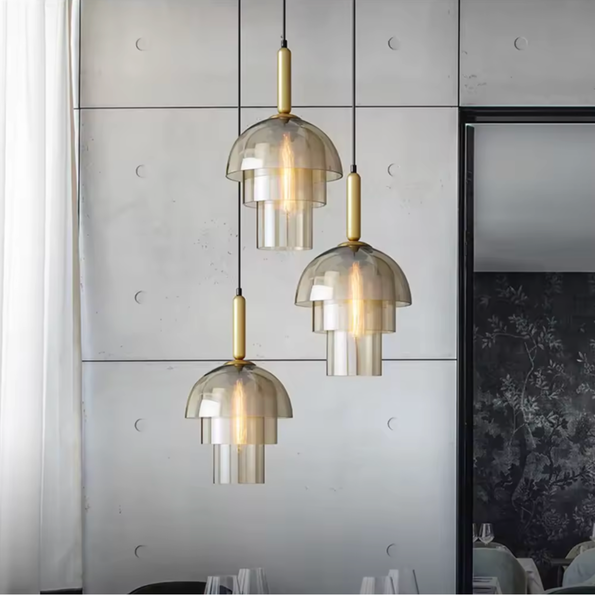 Modern interior design with pendant lights and a dining table.